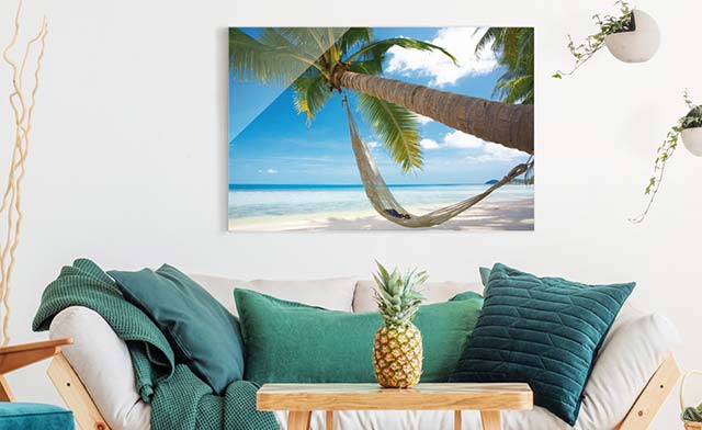 Glasbild Strand in der Karibik mit Palme und Hängematte