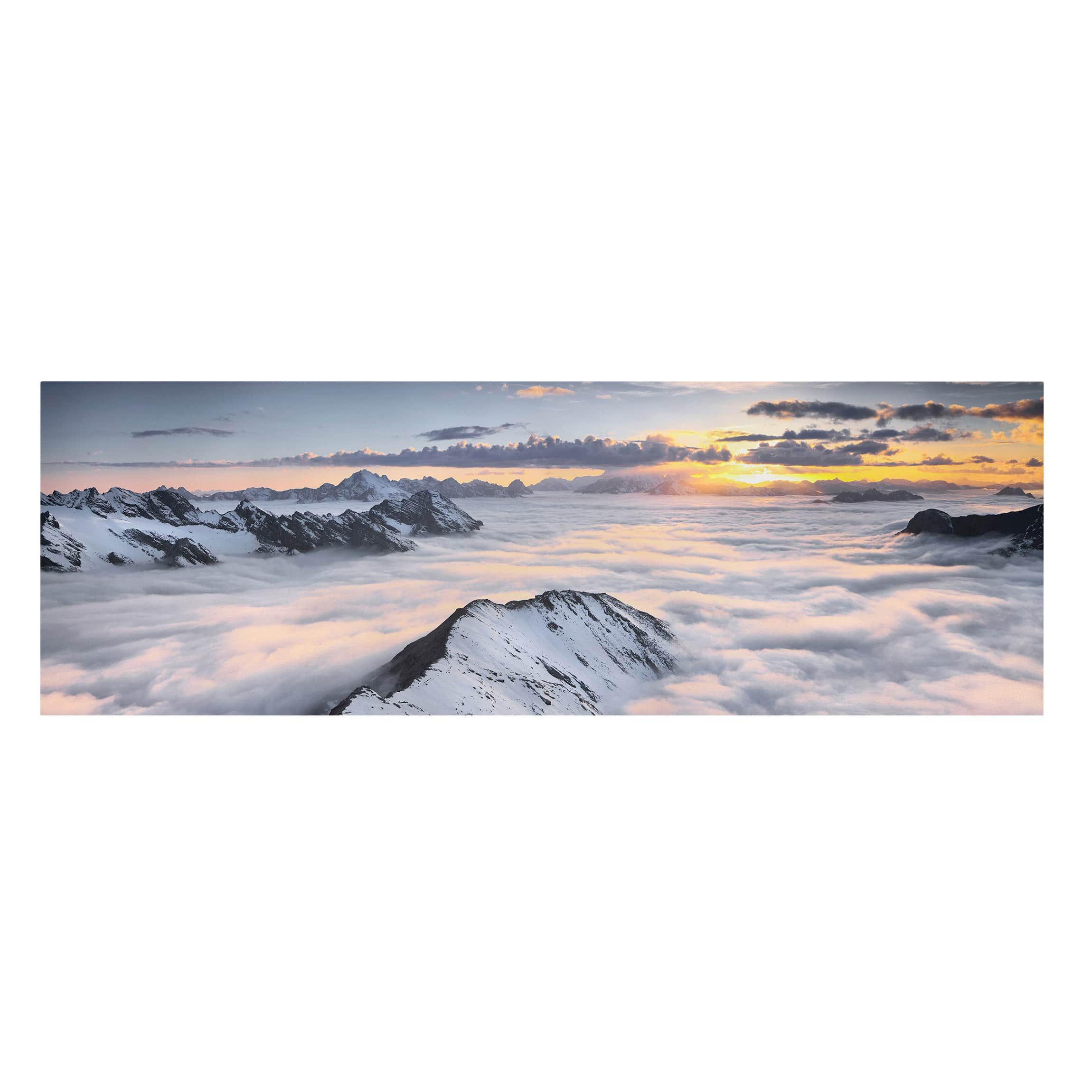 Blick über Wolken und Berge Leinwandbild im Panoramaformat | Bilderwelten