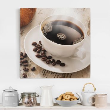 Leinwandbild - Dampfende Kaffeetasse mit Kaffeebohnen - Quadrat 1:1