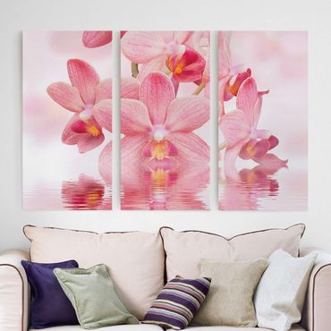 Leinwandbild 3-teilig - Rosa Orchideen auf Wasser - Hoch 1:2