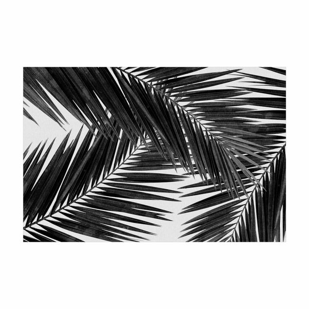 Teppich Blumen Blick durch Palmenblätter schwarz weiß