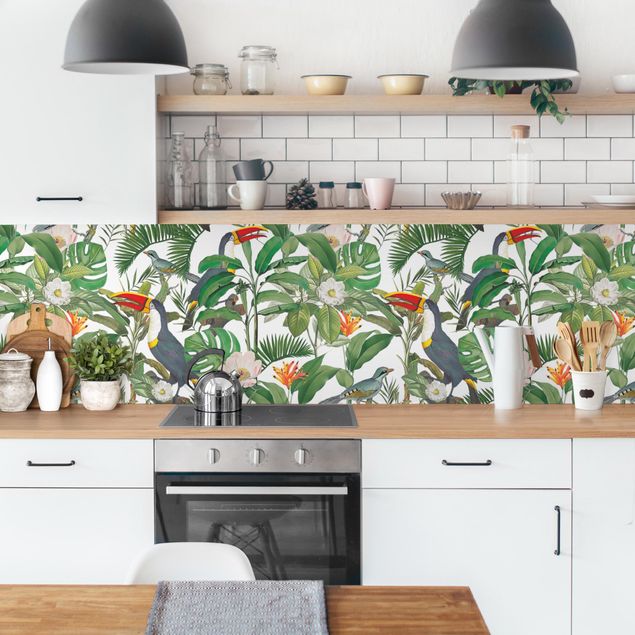 Küchenrückwand Glas Motiv Blumen Tropischer Tukan mit Monstera und Palmenblättern