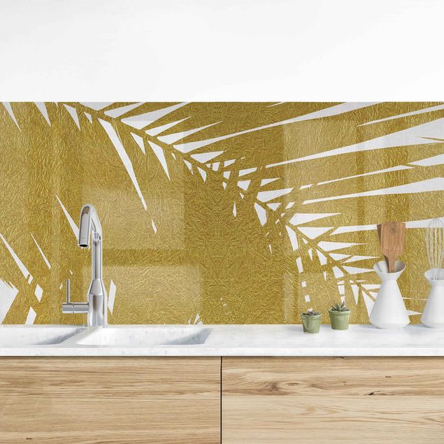 Küchenrückwände Platte Blick durch goldene Palmenblätter