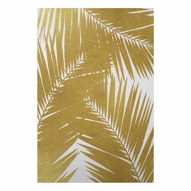 Foto auf Alu Dibond Blick durch goldene Palmenblätter