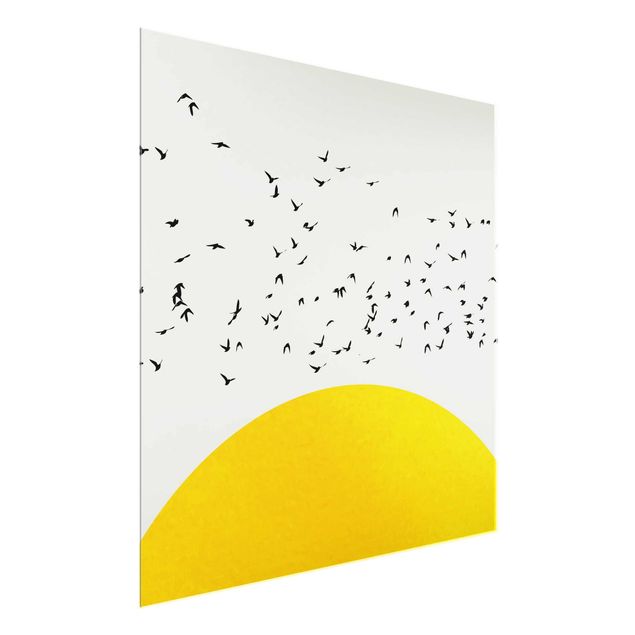 Glasbilder Natur Vogelschwarm vor gelber Sonne