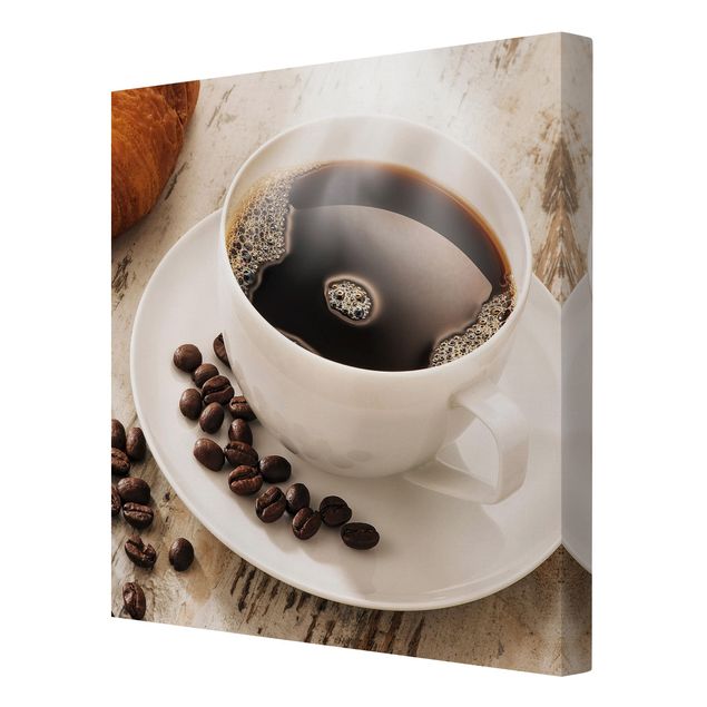 Leinwandbild - Dampfende Kaffeetasse mit Kaffeebohnen - Quadrat 1:1