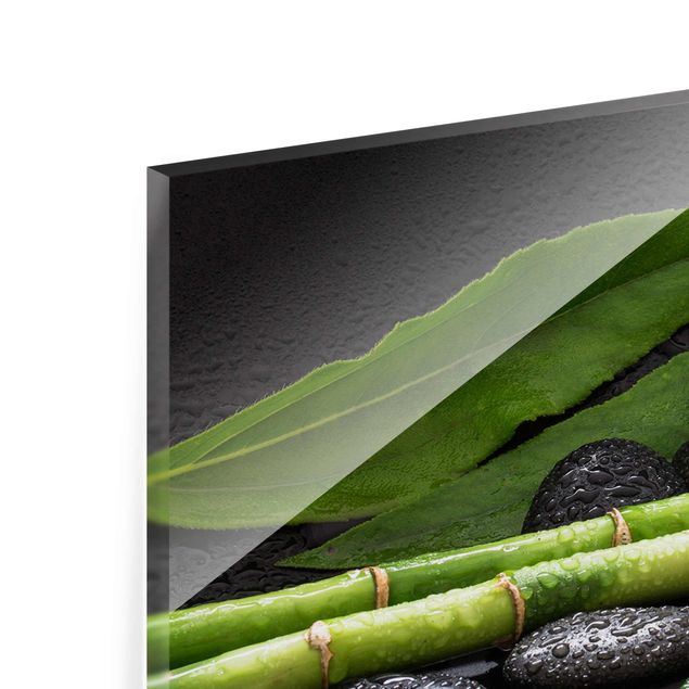 Glasbilder Grüner Bambus mit Orchideenblüte