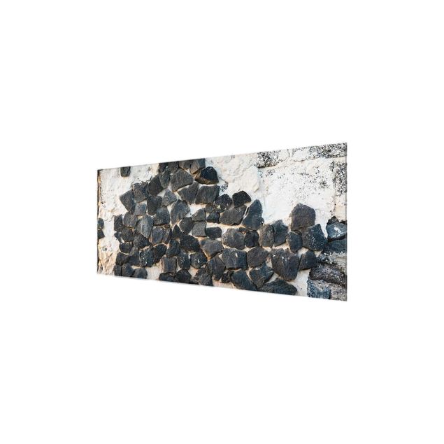 Glasbild - Mauer mit Schwarzen Steinen - Panorama