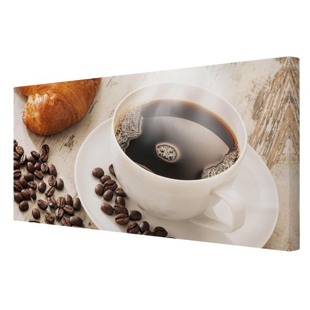 Leinwandbild - Dampfende Kaffeetasse mit Kaffeebohnen - Quer 2:1
