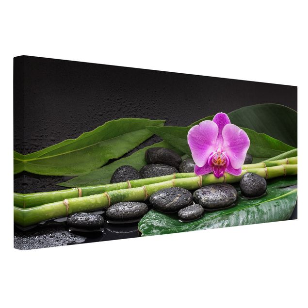 Kunstdrucke auf Leinwand Grüner Bambus mit Orchideenblüte