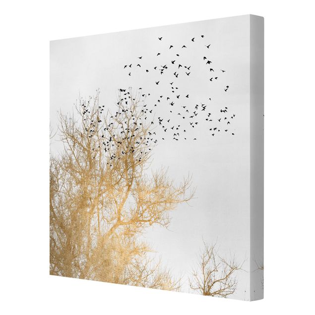 Leinwandbilder Tier Vogelschwarm vor goldenem Baum