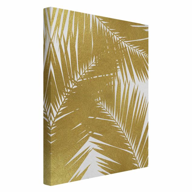 Kunstdrucke auf Leinwand Blick durch goldene Palmenblätter