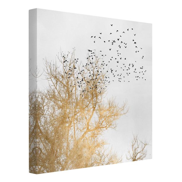 Leinwandbilder Natur Vogelschwarm vor goldenem Baum