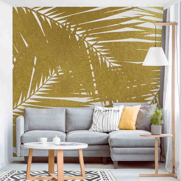 Wandtapete Design Blick durch goldene Palmenblätter