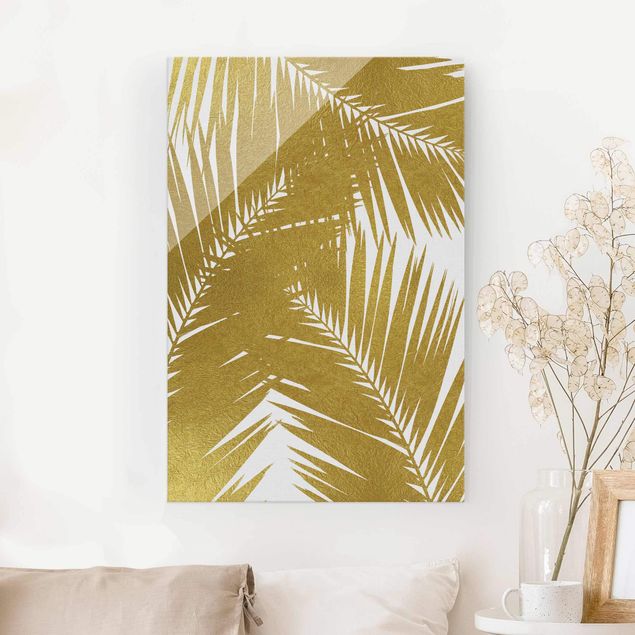 XXL Glasbilder Blick durch goldene Palmenblätter