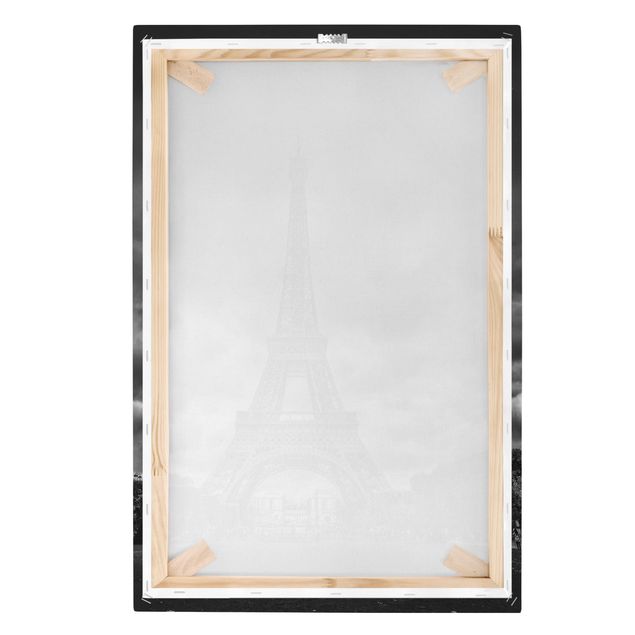 Leinwandbilder Eiffelturm vor Wolken schwarz-weiß