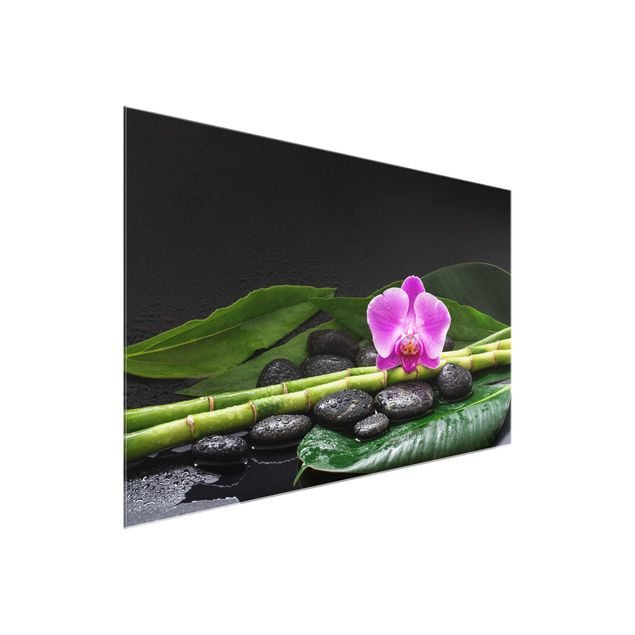 Glasbild Natur Grüner Bambus mit Orchideenblüte