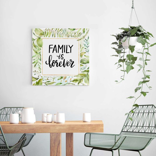 Glasbild Blumen Family is forever in goldenem Rahmen mit Palmenwedeln