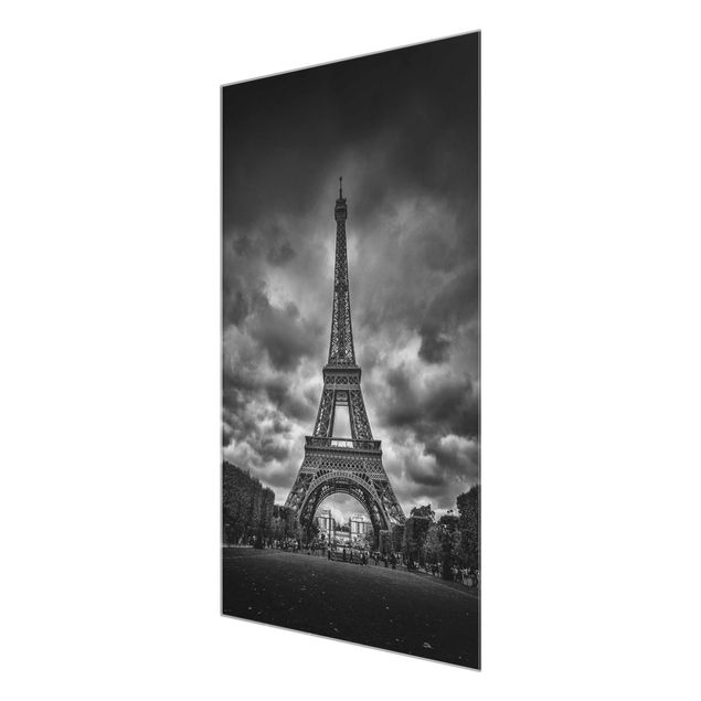 Glas Wandbilder Eiffelturm vor Wolken schwarz-weiß
