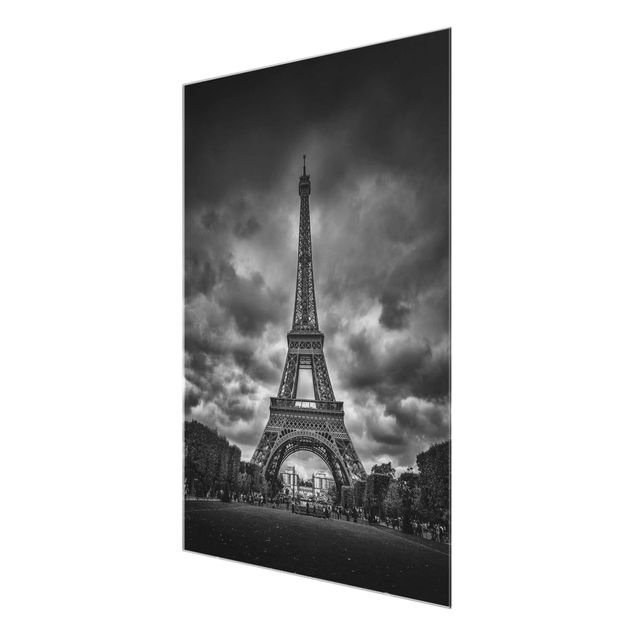 Glas Wandbilder Eiffelturm vor Wolken schwarz-weiß