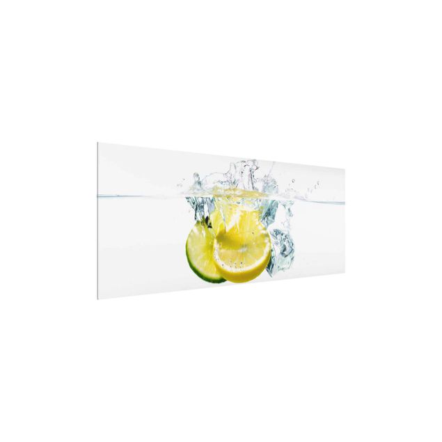 Glasbilder Zitrone und Limette im Wasser