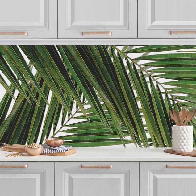 Küchenrückwände Platte Blick durch grüne Palmenblätter