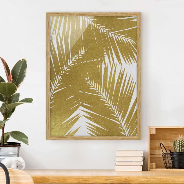 Landschaftsbilder mit Rahmen Blick durch goldene Palmenblätter