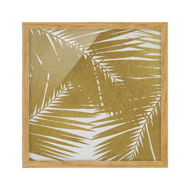 Bilder mit Rahmen Blick durch goldene Palmenblätter