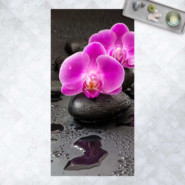 outdoor-teppich wetterfest Pinke Orchideenblüten auf Steinen mit Tropfen