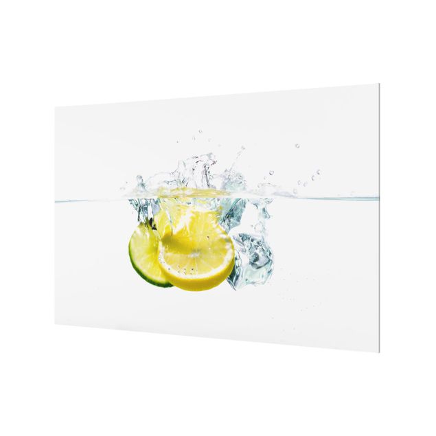 Spritzschutz Glas - Zitrone und Limette im Wasser - Querformat - 3:2