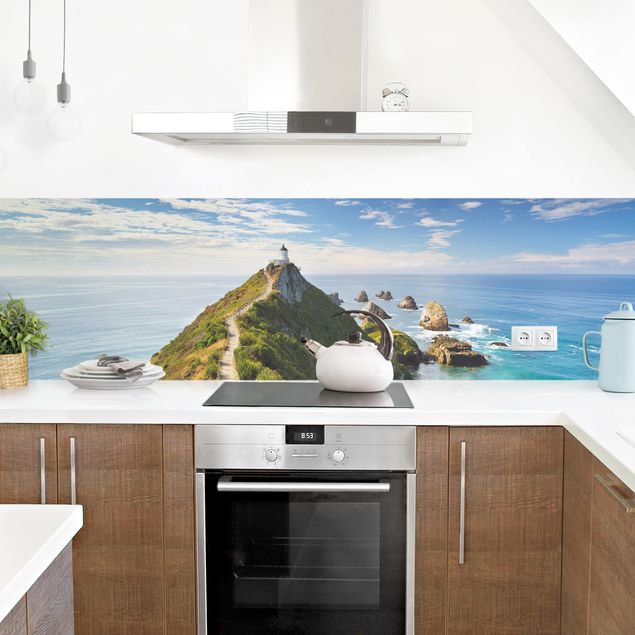 Küchenrückwand Glas Motiv Wald Nugget Point Leuchtturm und Meer Neuseeland
