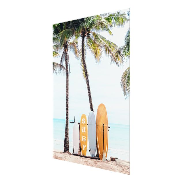 Glasbild - Gelbe Surfboards unter Palmen - Hochformat