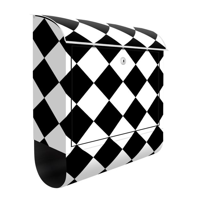 Weißer Briefkasten Geometrisches Muster gedrehtes Schachbrett Schwarz Weiß