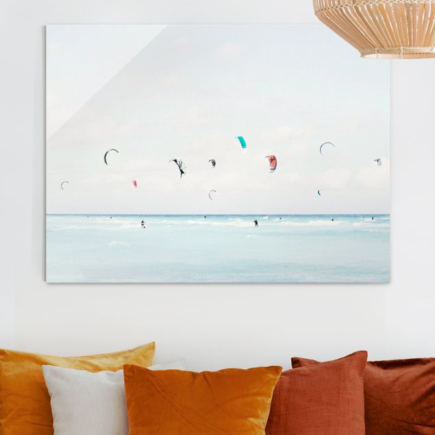 Glasbilder Strand Kitesurfer auf dem Meer