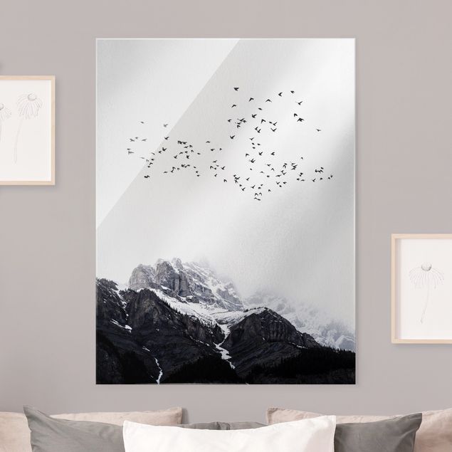 Glasbilder XXL Vogelschwarm vor Bergen Schwarz Weiß