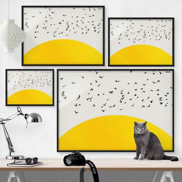 Wandbilder mit Rahmen Vogelschwarm vor gelber Sonne