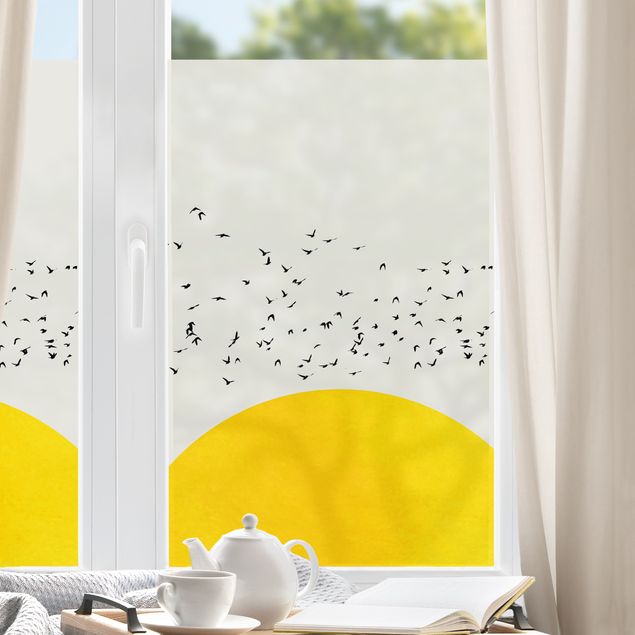 Fensterbilder Tiere Vogelschwarm vor gelber Sonne