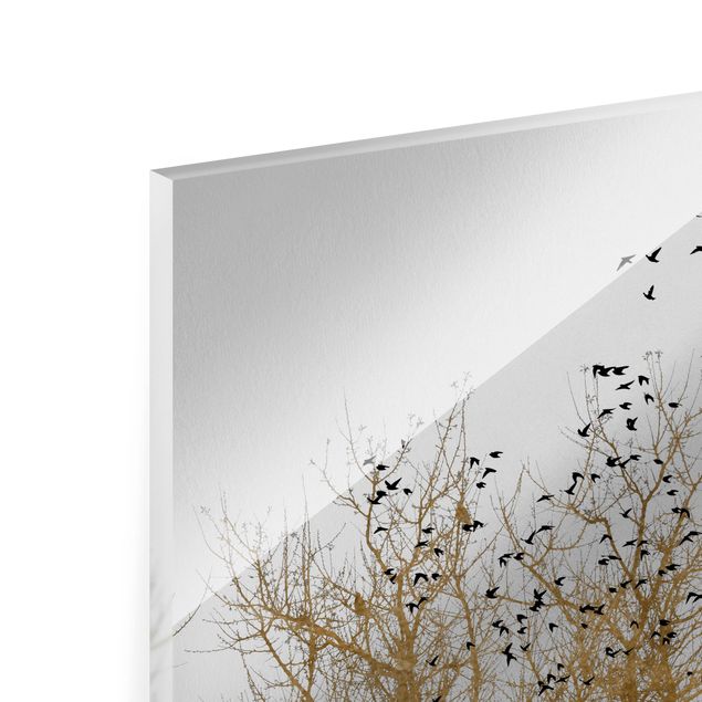 Bilder auf Glas Vogelschwarm vor goldenem Baum